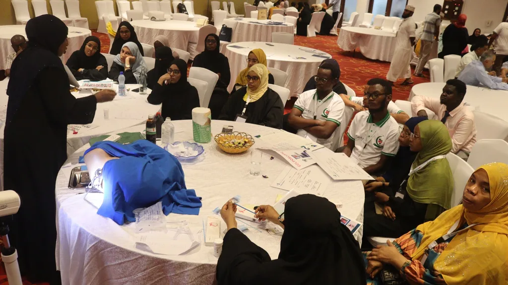 Delegates at round tables during a hands-on session of the 5th KAMMP Scientific Conference, 2023
