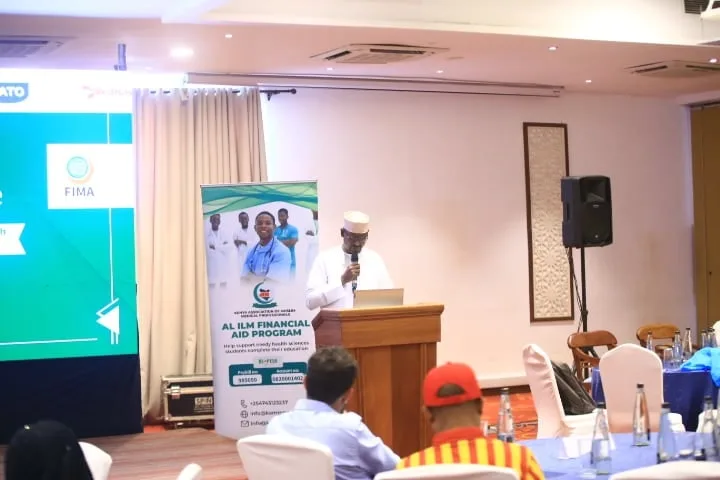 The Al Ilm Financial Aid Program presented from the lectern to the hall at the 7th KAMMP Scientific Conference, 2025