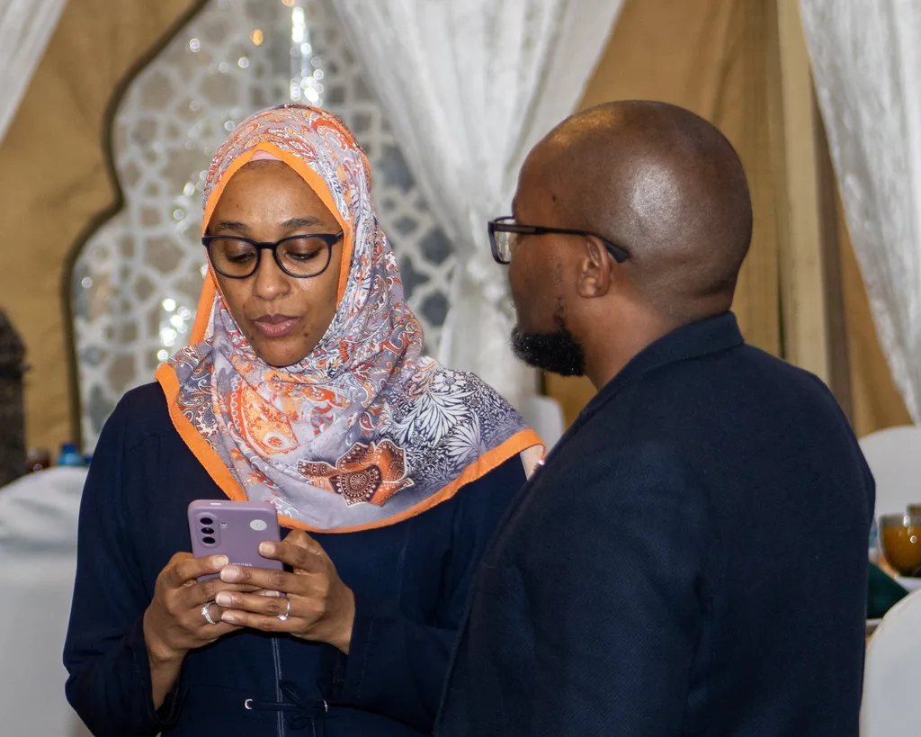 Two guests in conversation at the KAMMP Grand Iftar in Nairobi, 2026