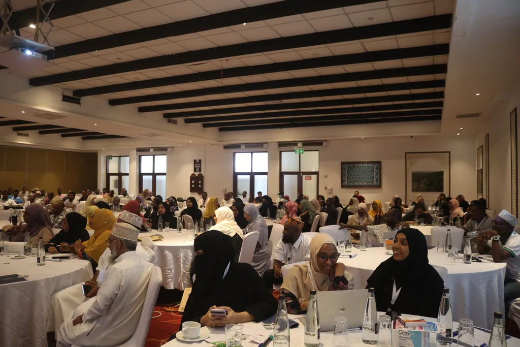 Delegates at round tables during a session of the 5th KAMMP Scientific Conference, 2023