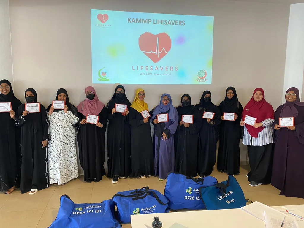 Women members holding certificates after a training session
