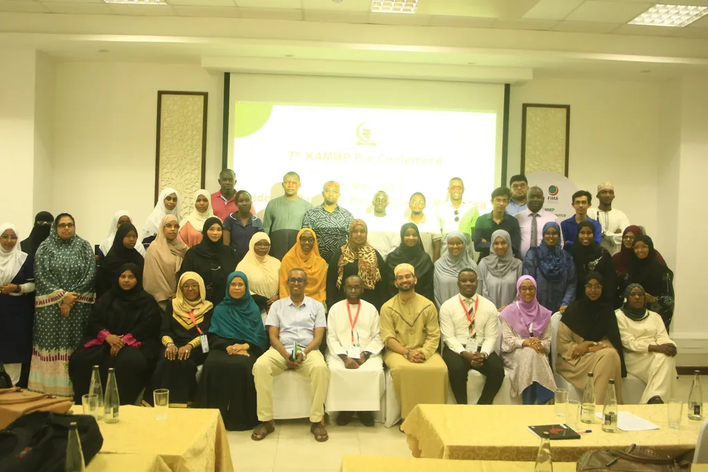 Delegates of the 7th KAMMP Scientific Conference seated and standing together for a group photograph in the conference hall, 2025
