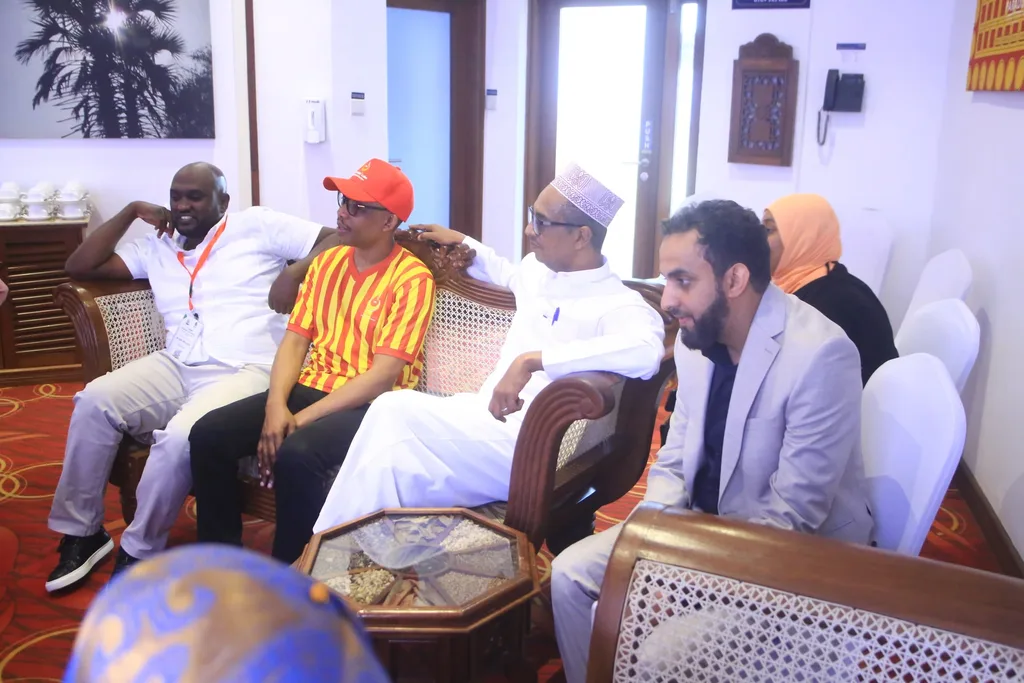 Delegates in conversation in the lounge of the conference venue, 2025