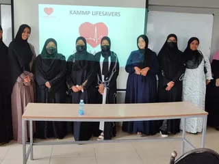 Women trainees of KAMMP Lifesavers standing together before the training screen, 2023