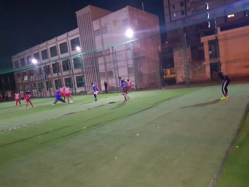 A KAMMP football match under floodlights