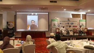 A speaker abroad joins the 5th KAMMP Scientific Conference by video on the main screen, 2023
