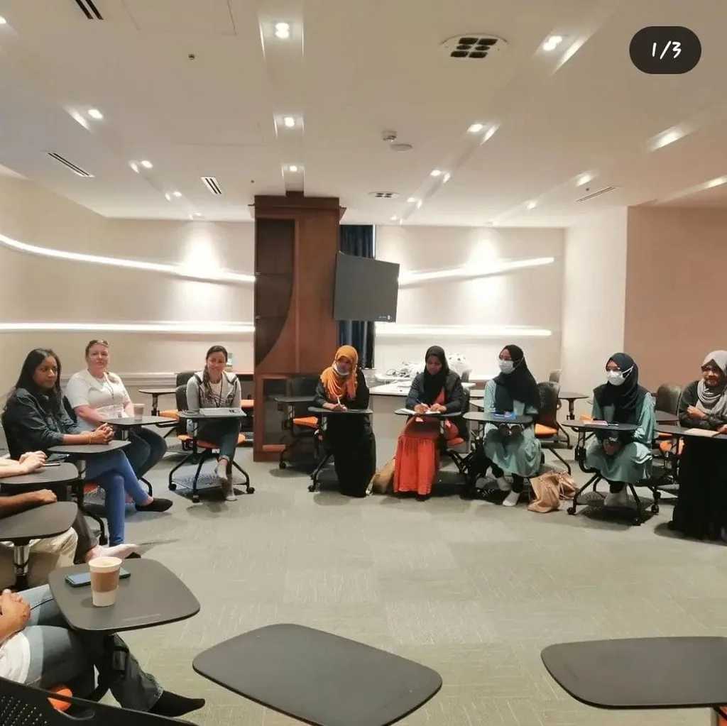 Members seated in a circle during a meeting
