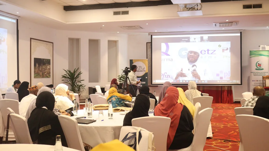 A session in the conference hall of the 5th KAMMP Scientific Conference, a sponsor slide on the screen, 2023