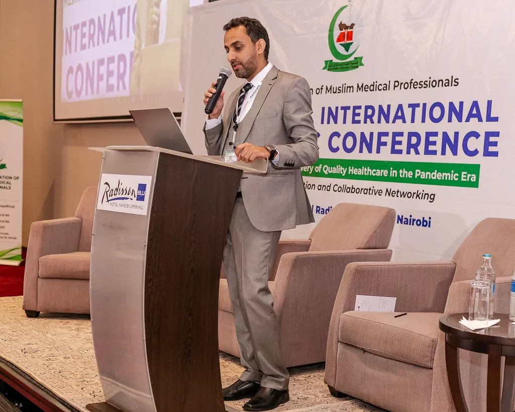 A speaker at the lectern of the 4th KAMMP Annual International Scientific Conference, Nairobi 2022