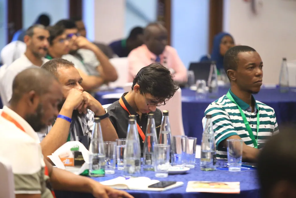Young doctors and students at a table during a session of the 7th KAMMP Scientific Conference, 2025