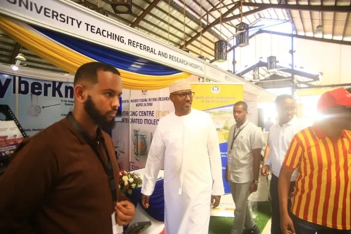 Delegates visit a teaching and referral hospital's stand in the exhibition hall of the 7th KAMMP Scientific Conference, 2025